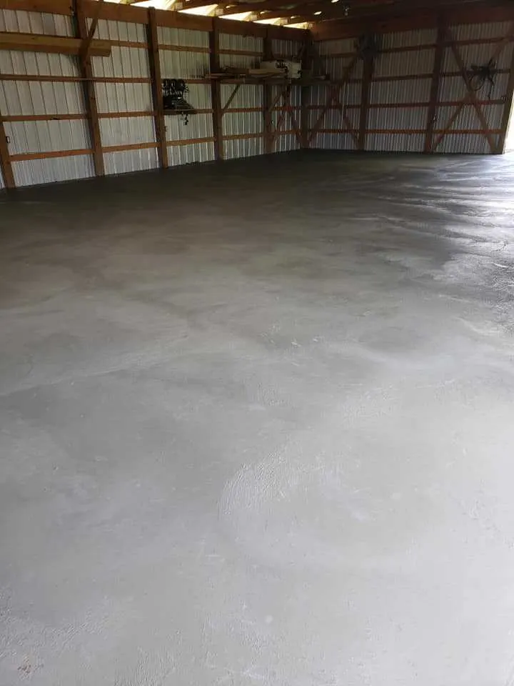 freshly troweled concrete slab inside an open barn in Palm Beach County