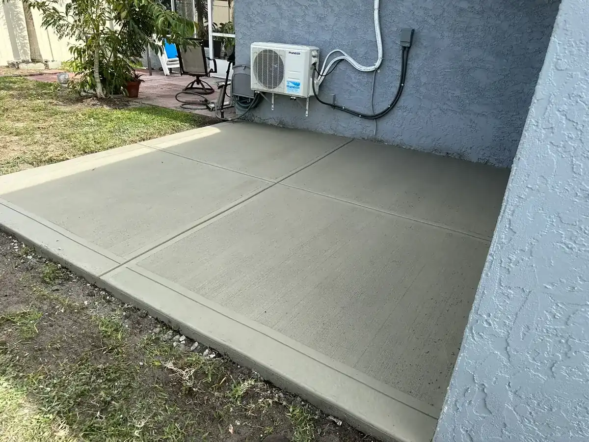 new concrete slab beside a house wall with jointed panels in West Palm Beach